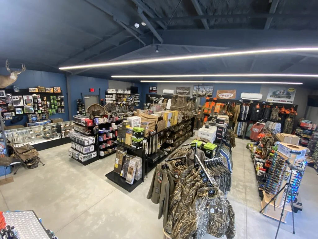 An overhead view of an outdoors shop featuring racks and shelves of clothing and accessories